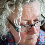 Lyn Carruthers making a self portrait in her studio in 2019